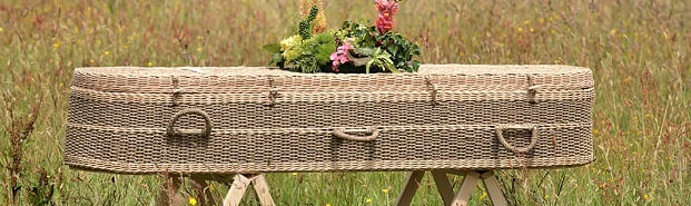 A coffin with flowers on it