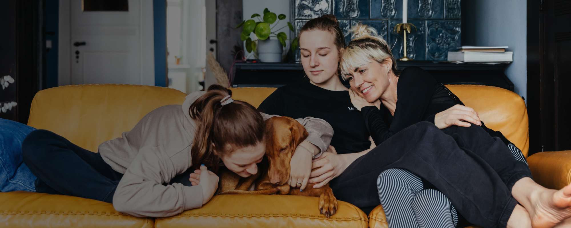 Family on sofa with dog